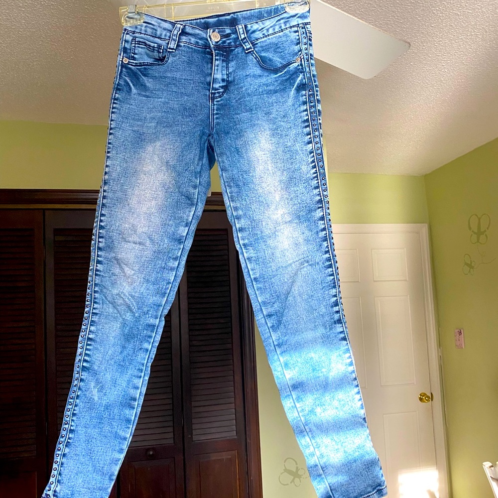little girl’s jeans with bronze beads on the sides!